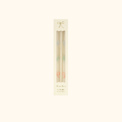 Velas con lazos en tonos pastel