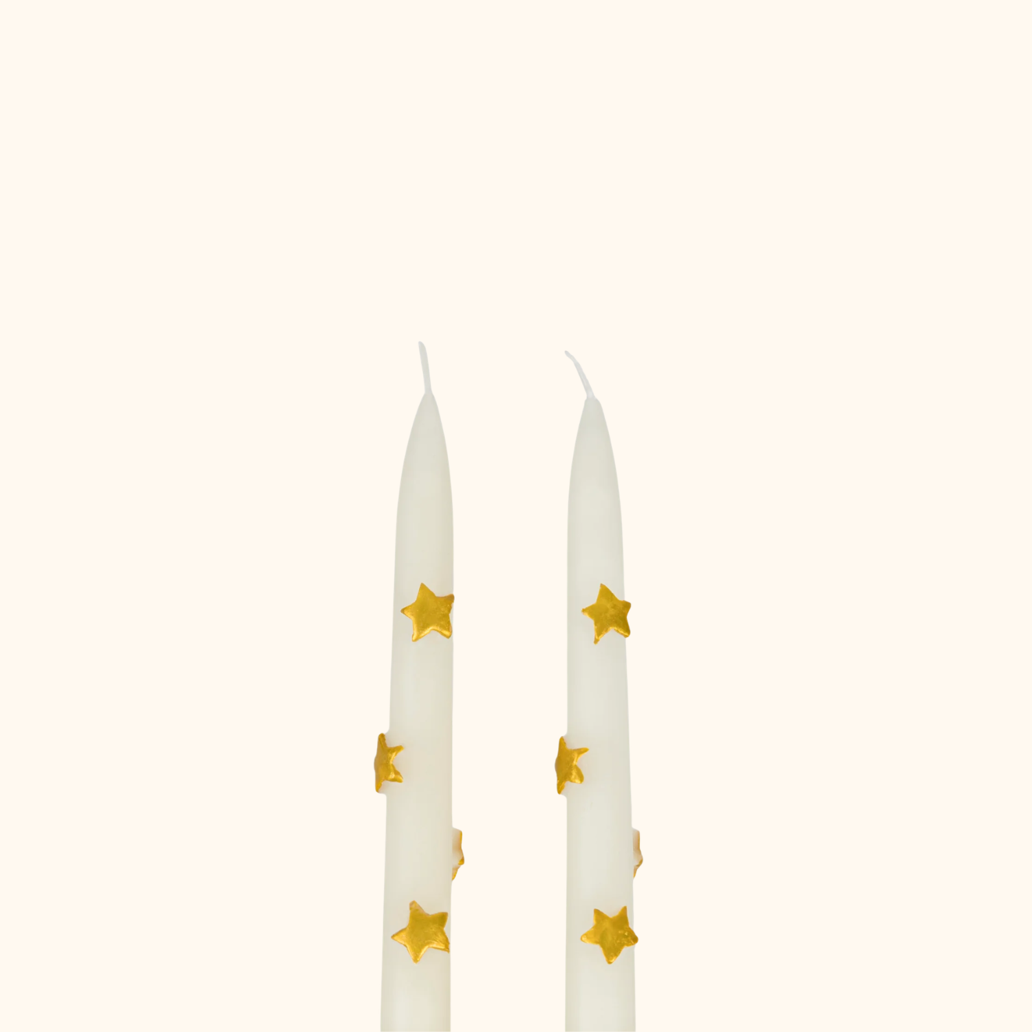 Velas de mesa con estrellas doradas