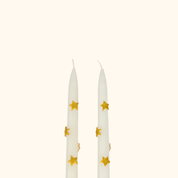 Velas de mesa con estrellas doradas