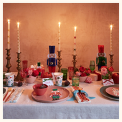 Velas de mesa con lazos dorados
